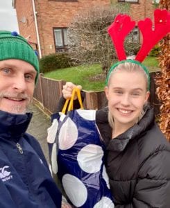 Father Christmas and Daughter deliver food packages